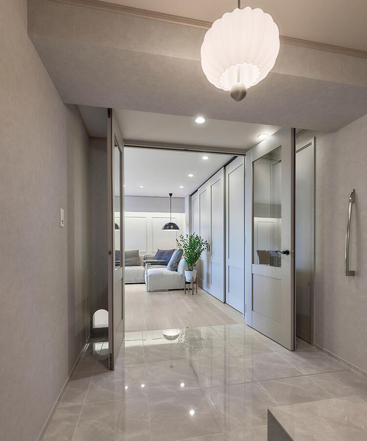 玄関ホールを広く設け、LDKへ続く扉の足元には愛猫のための入口を設計